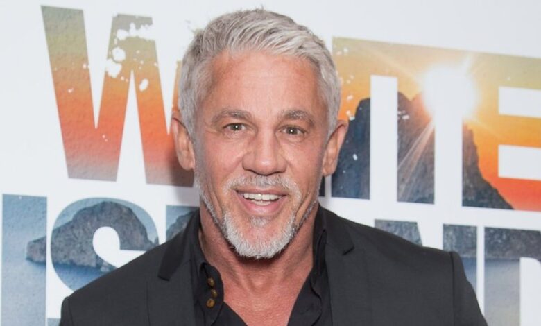 Wayne Lineker smiling during a photoshoot in Ibiza.