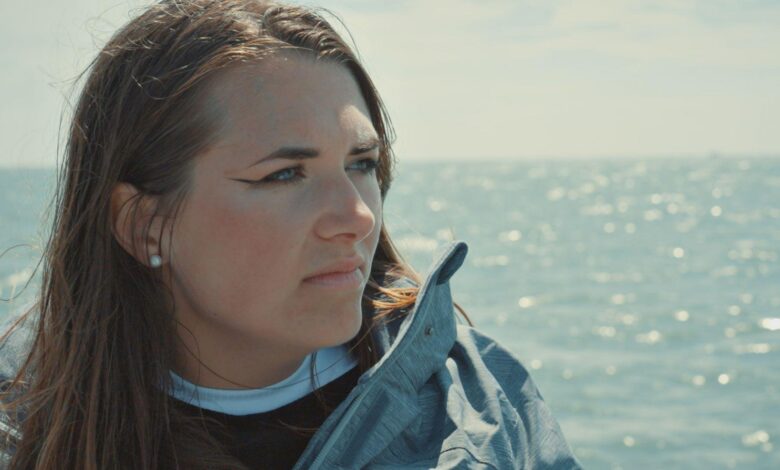 Chloe Dobbs delivering a speech on education reform and political change in the UK."