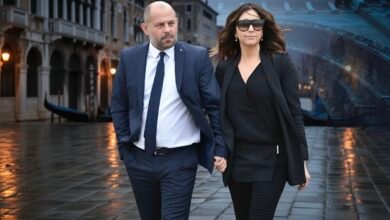 Drew Pritchard standing in his antique shop surrounded by vintage furniture and reclaimed items.