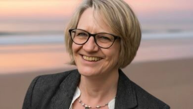 Pat Gordon Smith speaking at a community event, sharing insights with an engaged audience.”