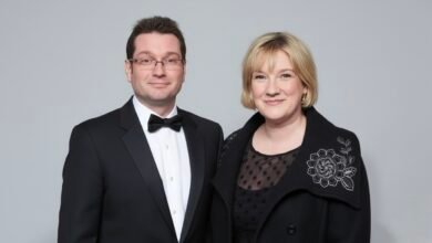 Professional headshot of Andrew Millican in business attire