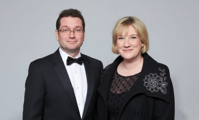 Professional headshot of Andrew Millican in business attire