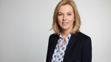 Mary Nightingale presenting the ITV Evening News in studio, smiling at the camera.