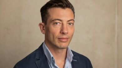 Roy Horgan speaking at a technology conference about retail innovation.”