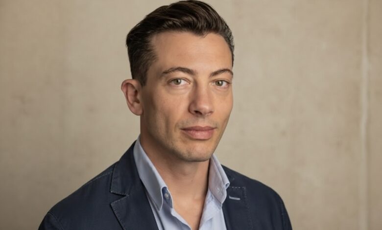 Roy Horgan speaking at a technology conference about retail innovation.”