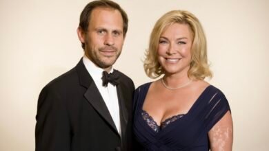 Portrait of Damian Schnabel wearing business attire, smiling confidently in a modern office setting