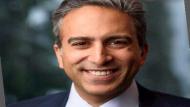 Portrait of Meekal Hashmi, the visionary leader in global finance shaping the future of financial systems with strategic insight and technological innovation."