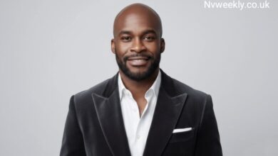 Dean Forbes smiling in a professional business headshot wearing a suit.